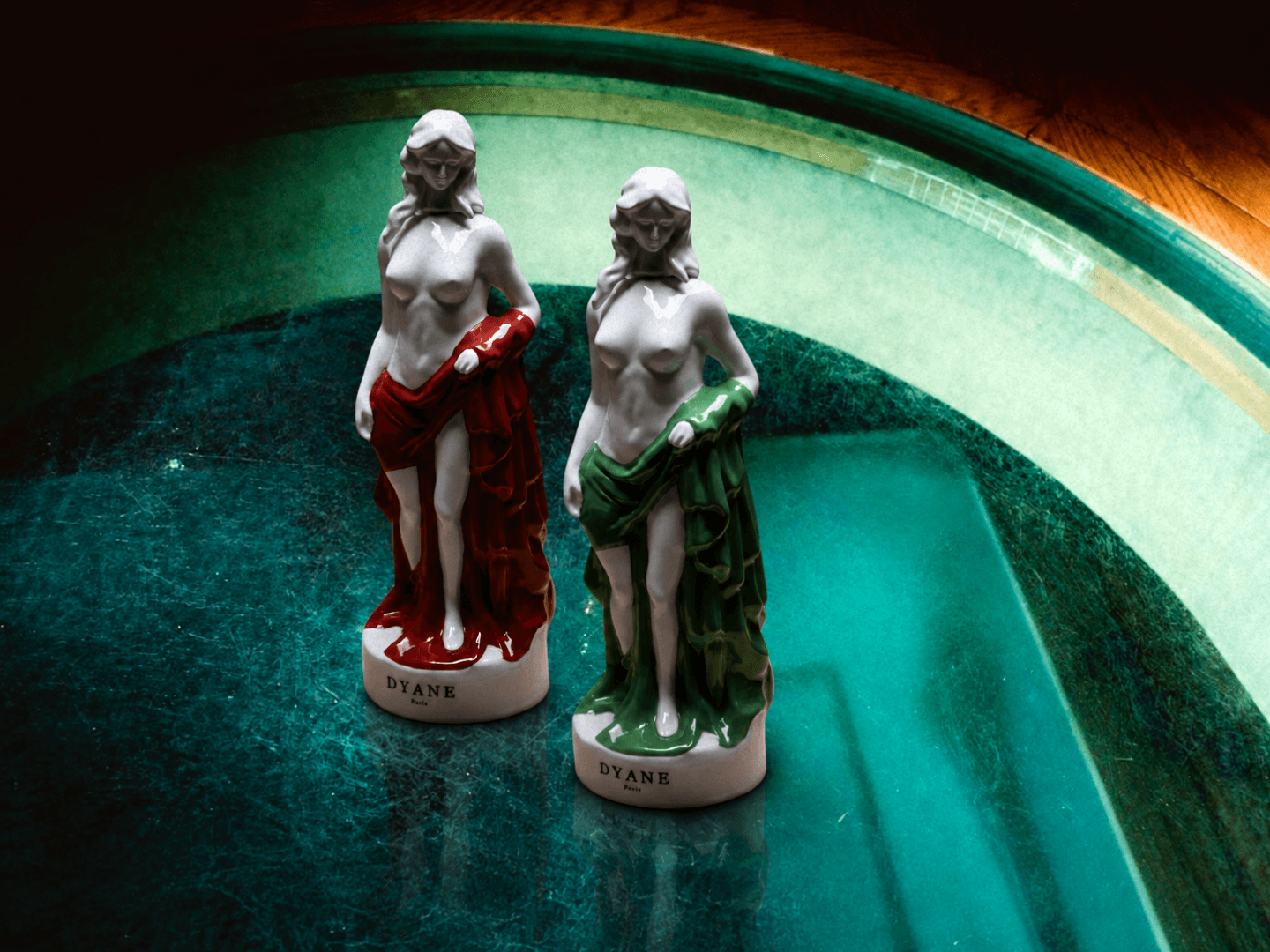Dyane Paris porcelain sculptures with red and green drapery